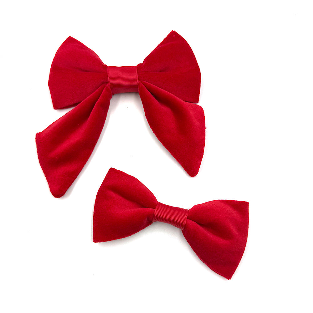 Two red bow ties on a white background handmade by Barkley And Fetch
