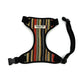 Striped dog harness with a visible brand label on a white background