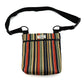 Striped bag with a black strap on a white background