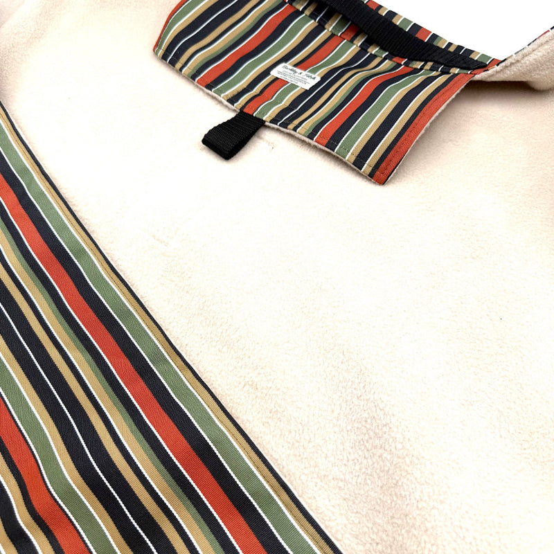 Striped fabric with a visible brand label on a white background