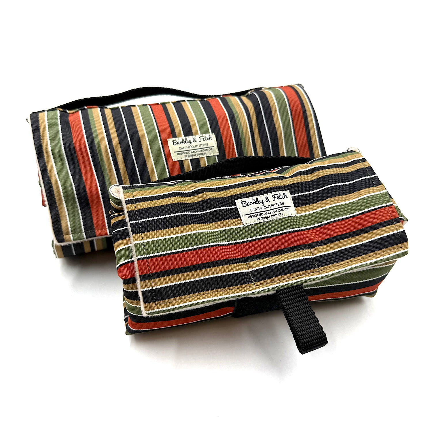 Two striped rolled up settle mats with a visible brand label on a white background handmade in UK by Barkley And Fetch