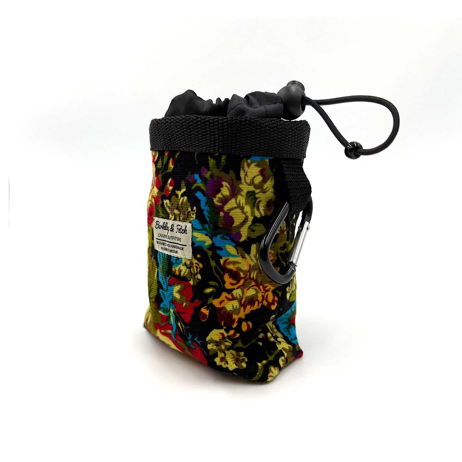 Colorful drawstring pouch with floral pattern and carabiner on a white background