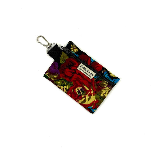 Colorful keychain pouch with floral design on a white background