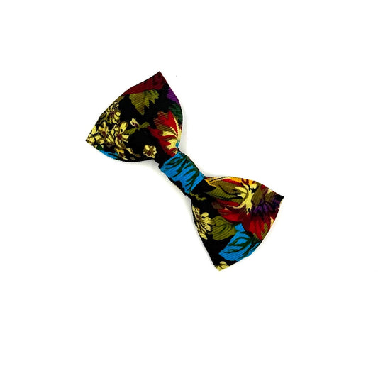 Colorful bow tie with a tropical pattern on a white background