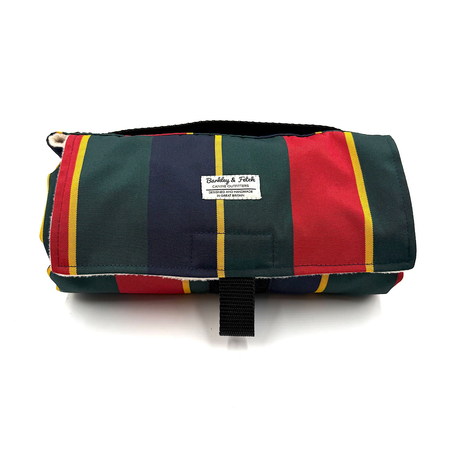 Multicolored striped rolled up settle mat with a visible brand label on a white background handmade in UK by Barkley And Fetch