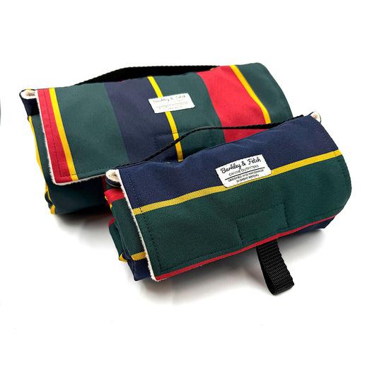 Two striped fabric settle mat rolls with visible branding on a white background handmade in UK by Barkley And Fetch