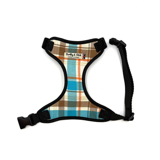 Plaid dog harness with black straps on a white background