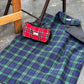 black watch tartan settle mat British handmade by Barkley and Fetch on a tarmac floor