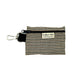 A beige and black dogtooth check patterned poo bag holder with a black clip and the brand name 'Barkley & Fetch' on the front.