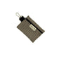 Houndstooth patterned pouch with keychain on a white background