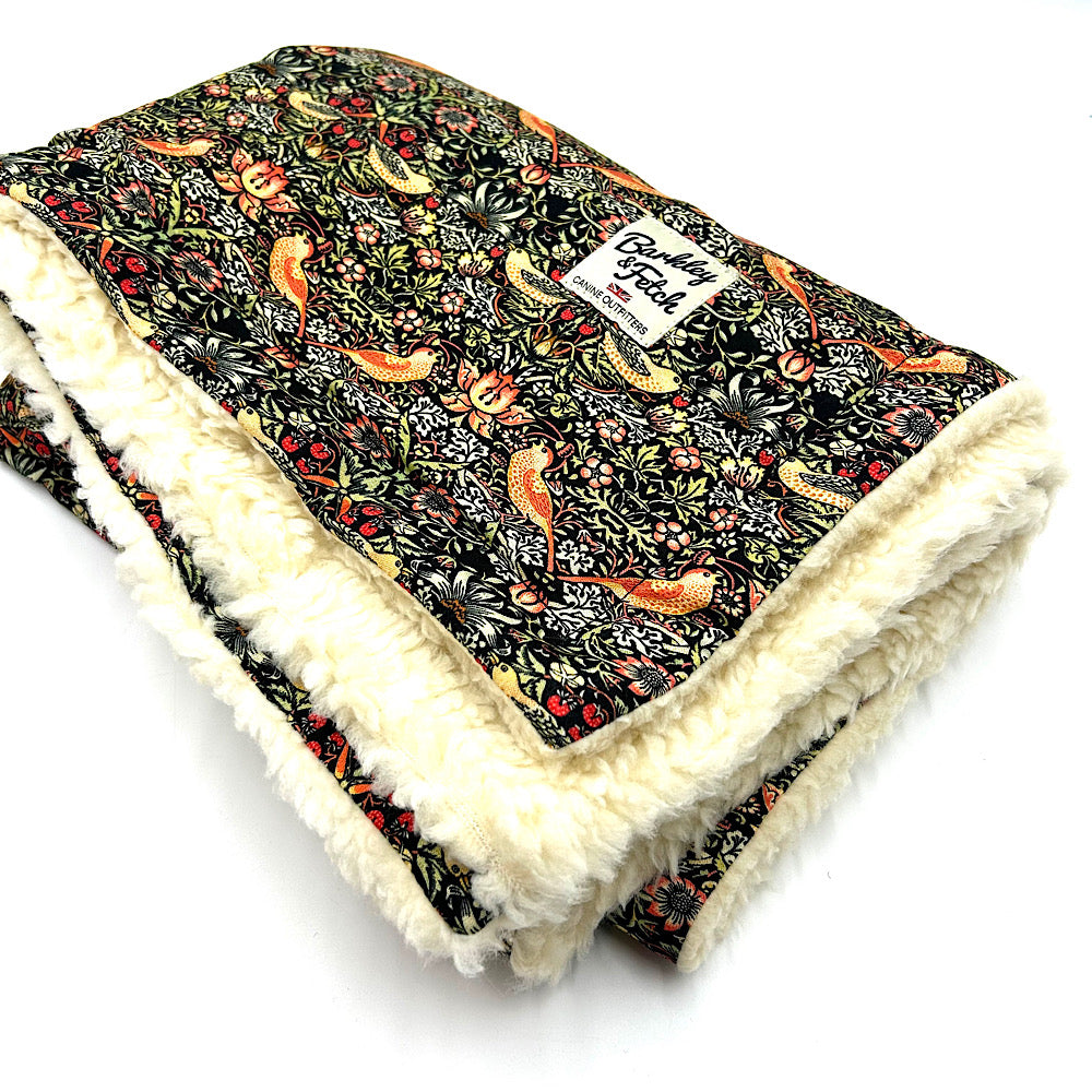 Floral-patterned William morris blanket with white sherpa lining on a white background handmade in UK by Barkley And Fetch