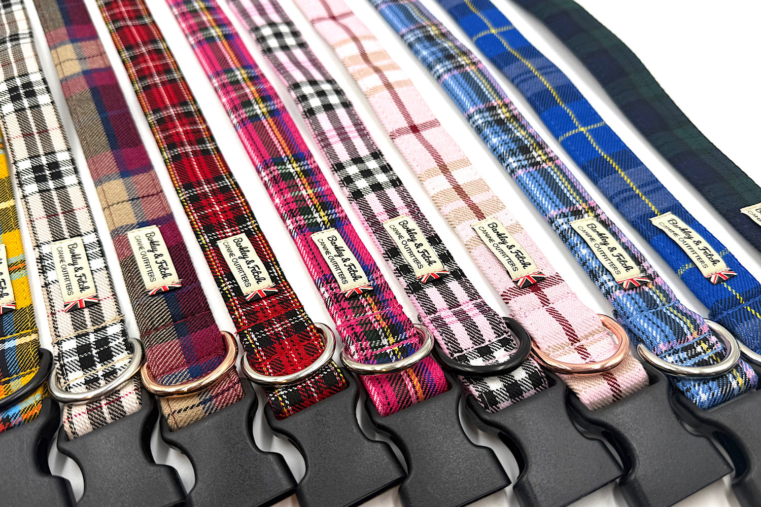 Collection of plaid dog collars with visible brand labels.
