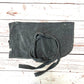 Dark gray dog towel with drawstrings on a wooden surface handmade in uk by Barkley and Fetch