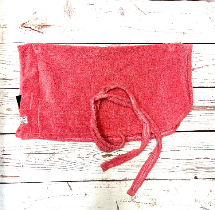 Red dog towel with a knot on a wooden surface handmade in uk by Barkley and Fetch