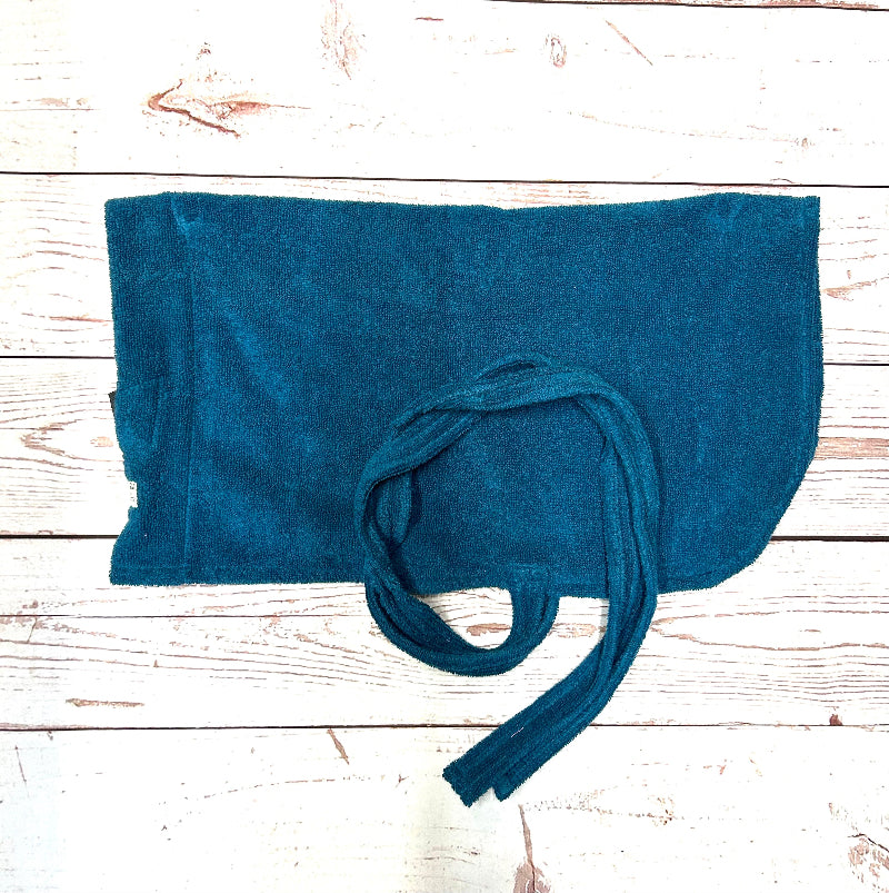 Blue dog towel with a knot on a wooden surface handmade in uk by Barkley and Fetch