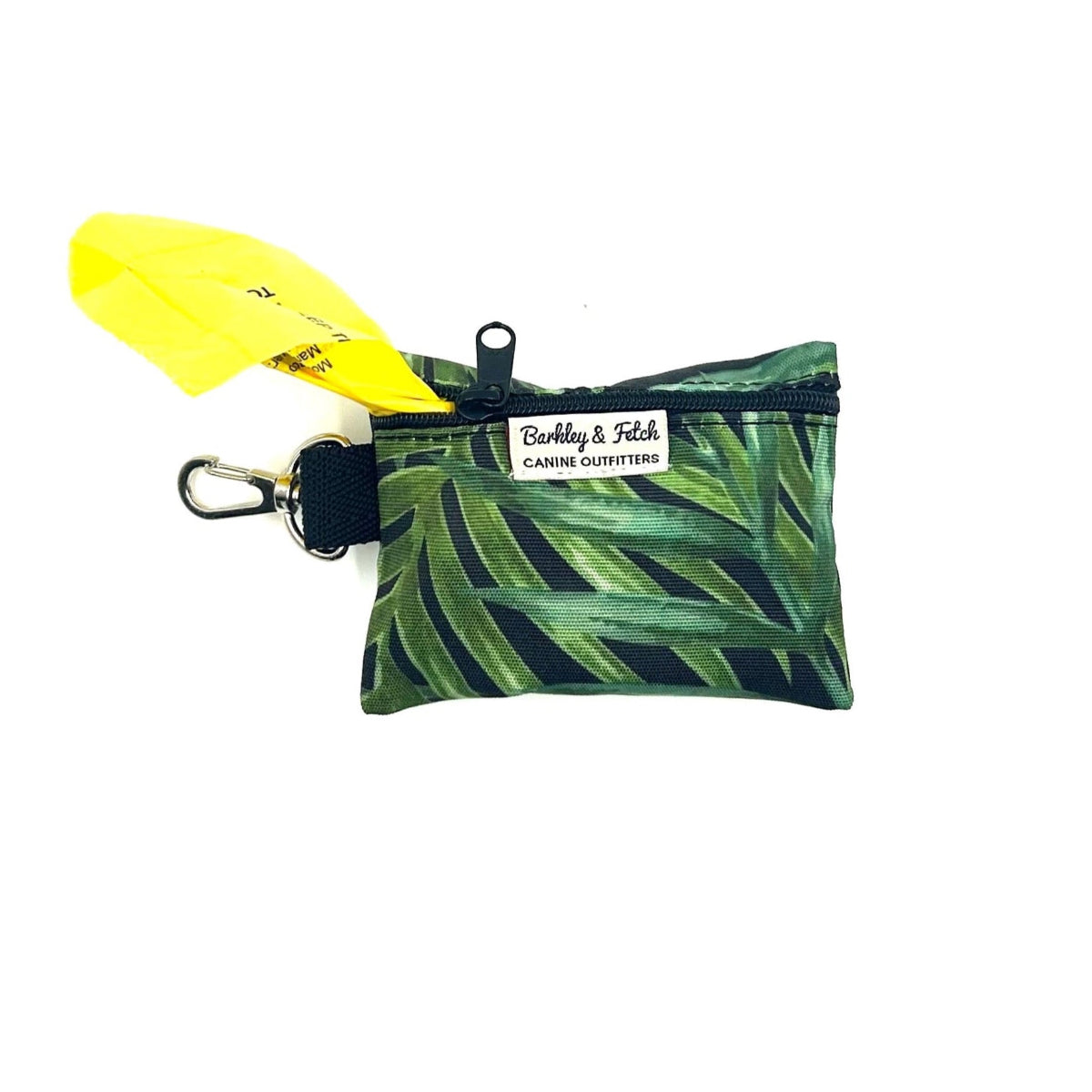 Small pouch with leaf pattern and yellow object on a white background