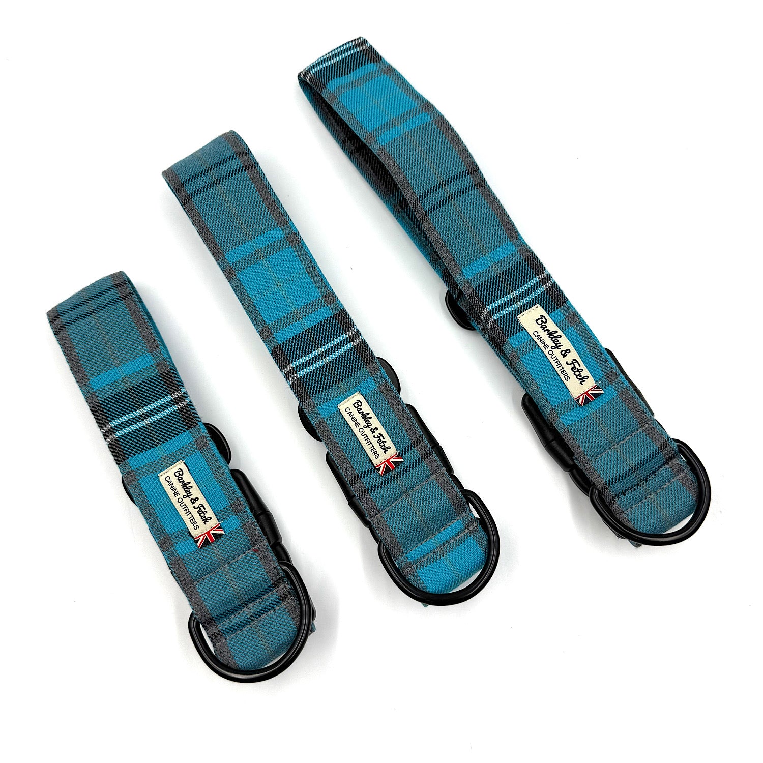 Three blue plaid dog collars with visible brand labels on a white background