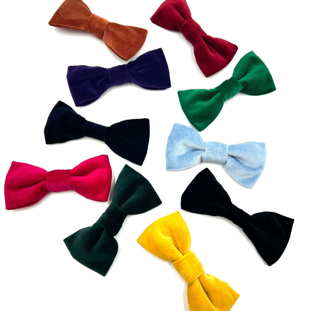 Collection of colorful bow ties on a white background British handmade by Barkley and Fetch