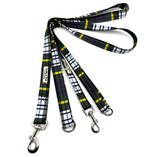 Plaid dog leash with metal clips on a white background