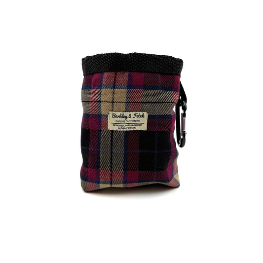 Plaid patterned pouch with a black carabiner on a white background