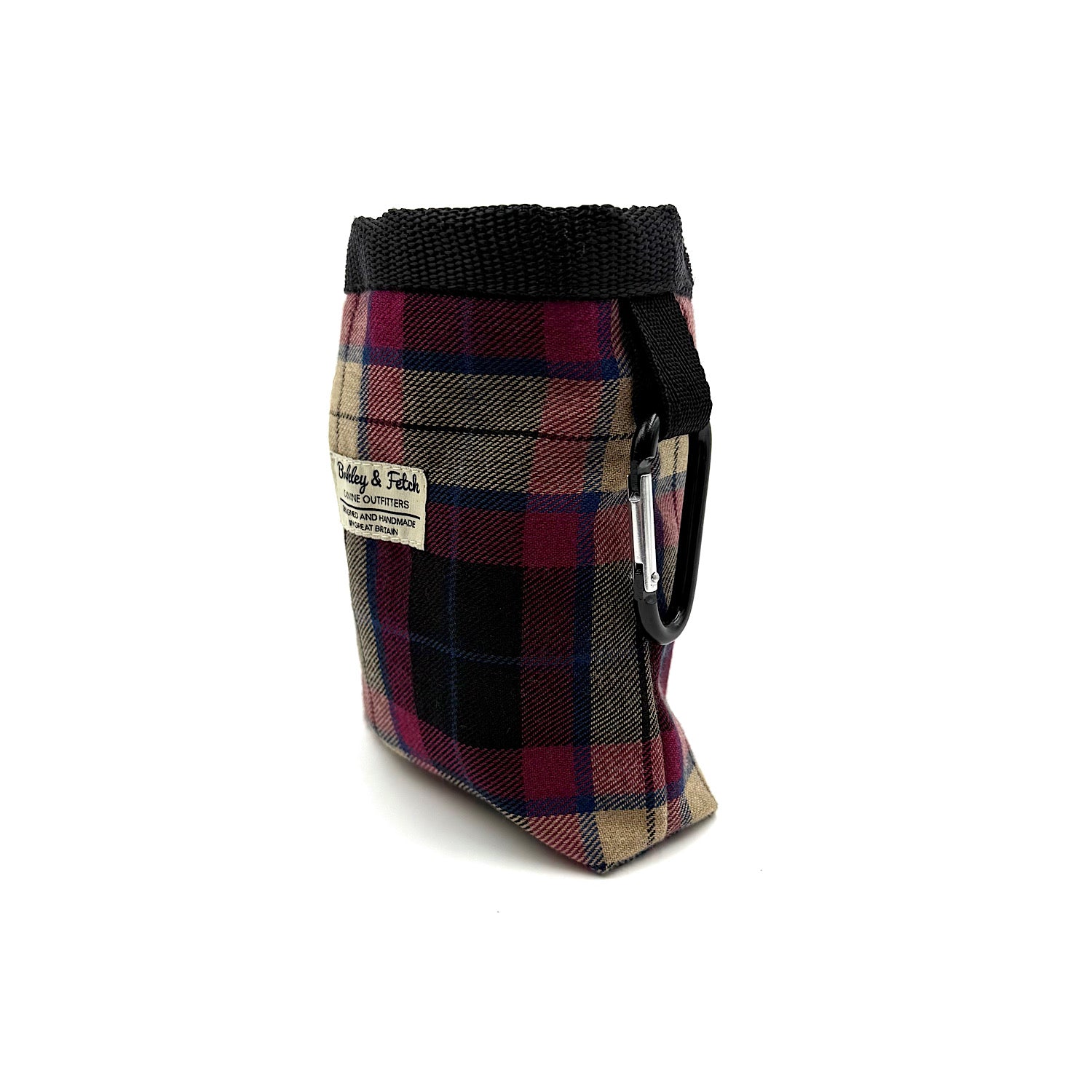 Plaid dog treat bag with black strap on a white background