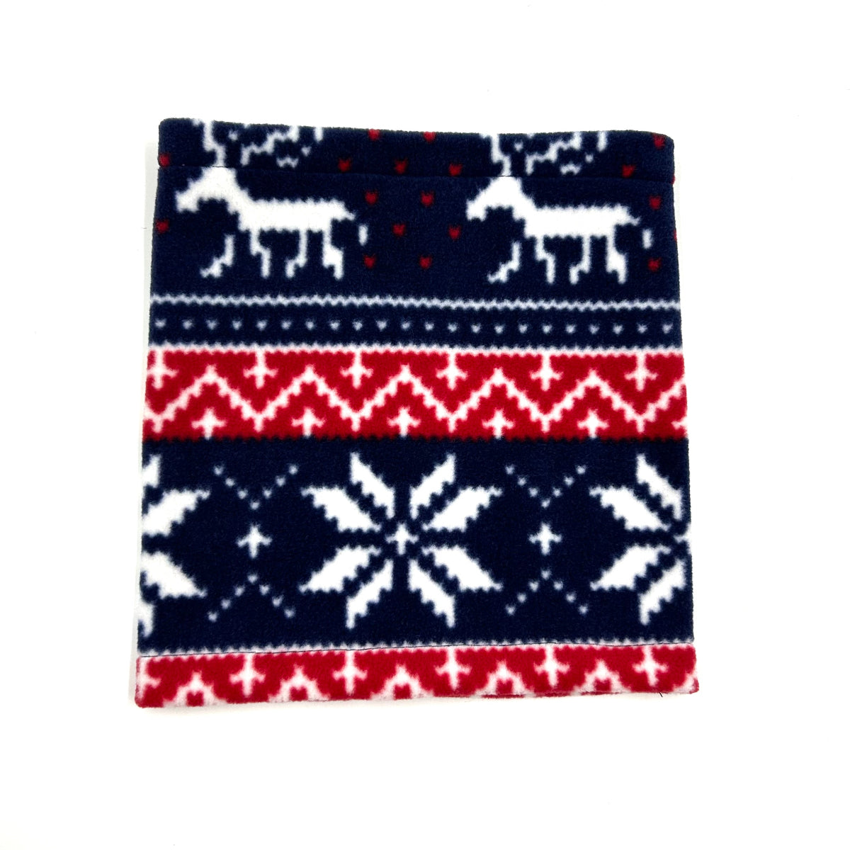 A festive red, white, and blue fairisle pattern dog snood with a hole for a collar, displayed flat handmade by Barkley and Fetch uk