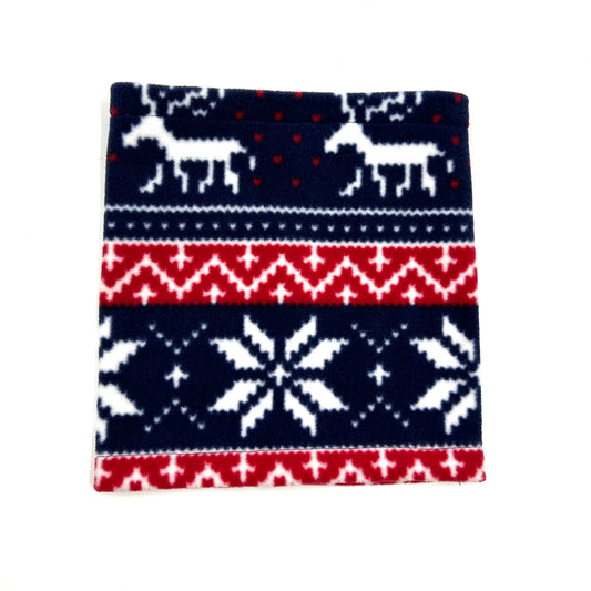 A festive red, white, and blue fairisle pattern dog snood with a hole for a collar, displayed flat handmade by Barkley and Fetch uk