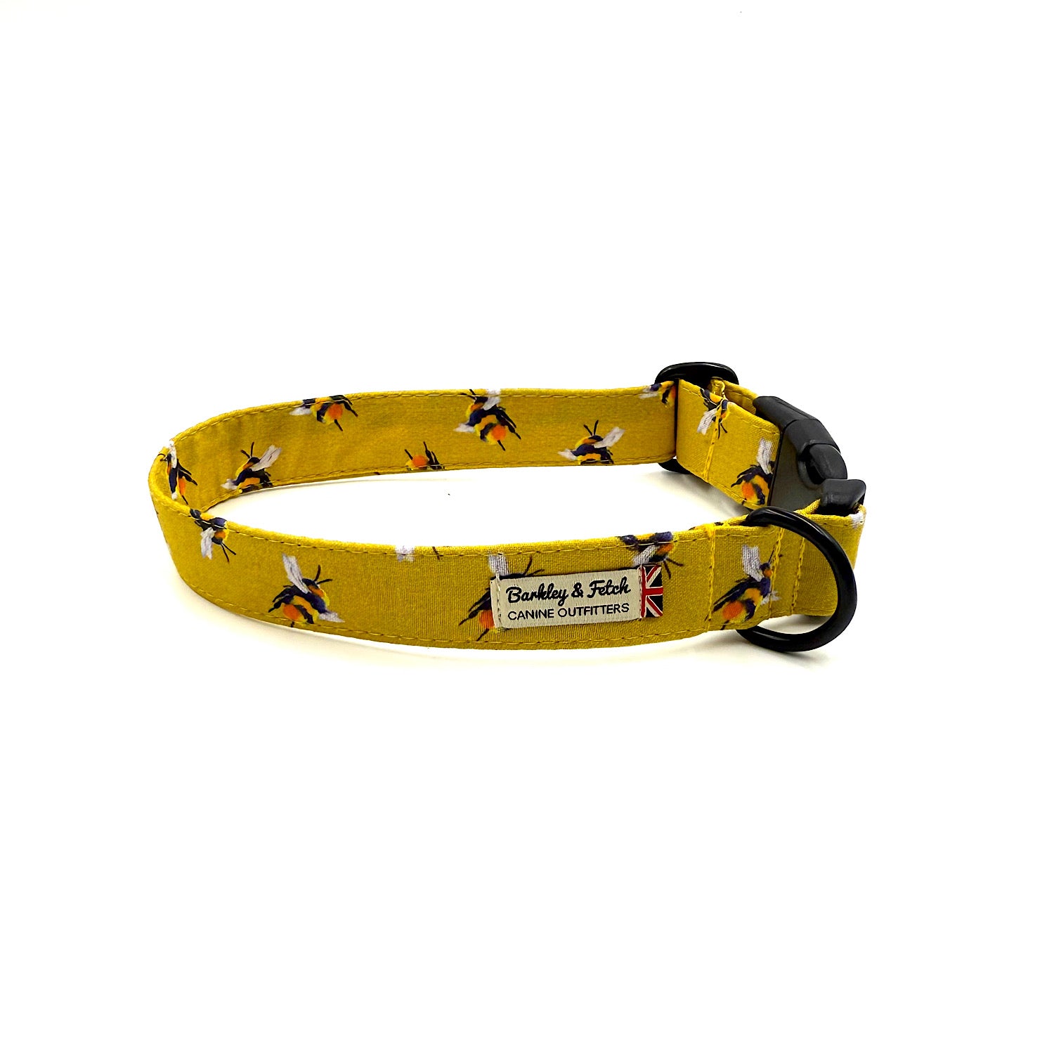 Yellow dog collar with bee pattern and black buckle on a white background