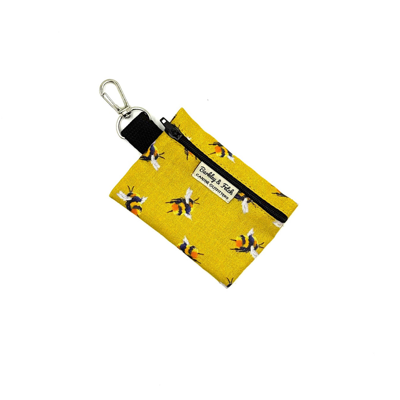 Yellow fabric key fob with bee pattern on a white background