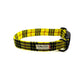 Yellow and black plaid dog collar with a visible brand label on a white background