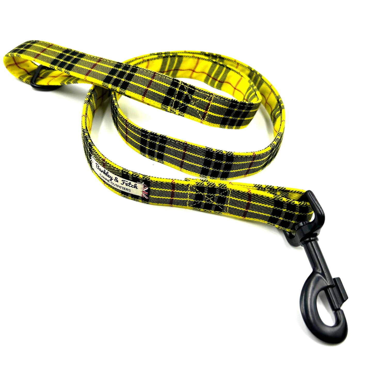 Yellow and black plaid dog leash with a clip on a white background