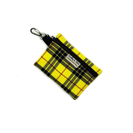 Yellow and black plaid keychain pouch on a white background