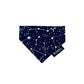 Navy blue dog bandana with white constellations and 'PURRL' text on a white background