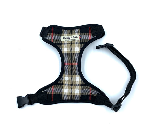 A black and beige tartan fabric dog harness with a side release buckle and webbing straps, featuring a heavy duty d-ring.