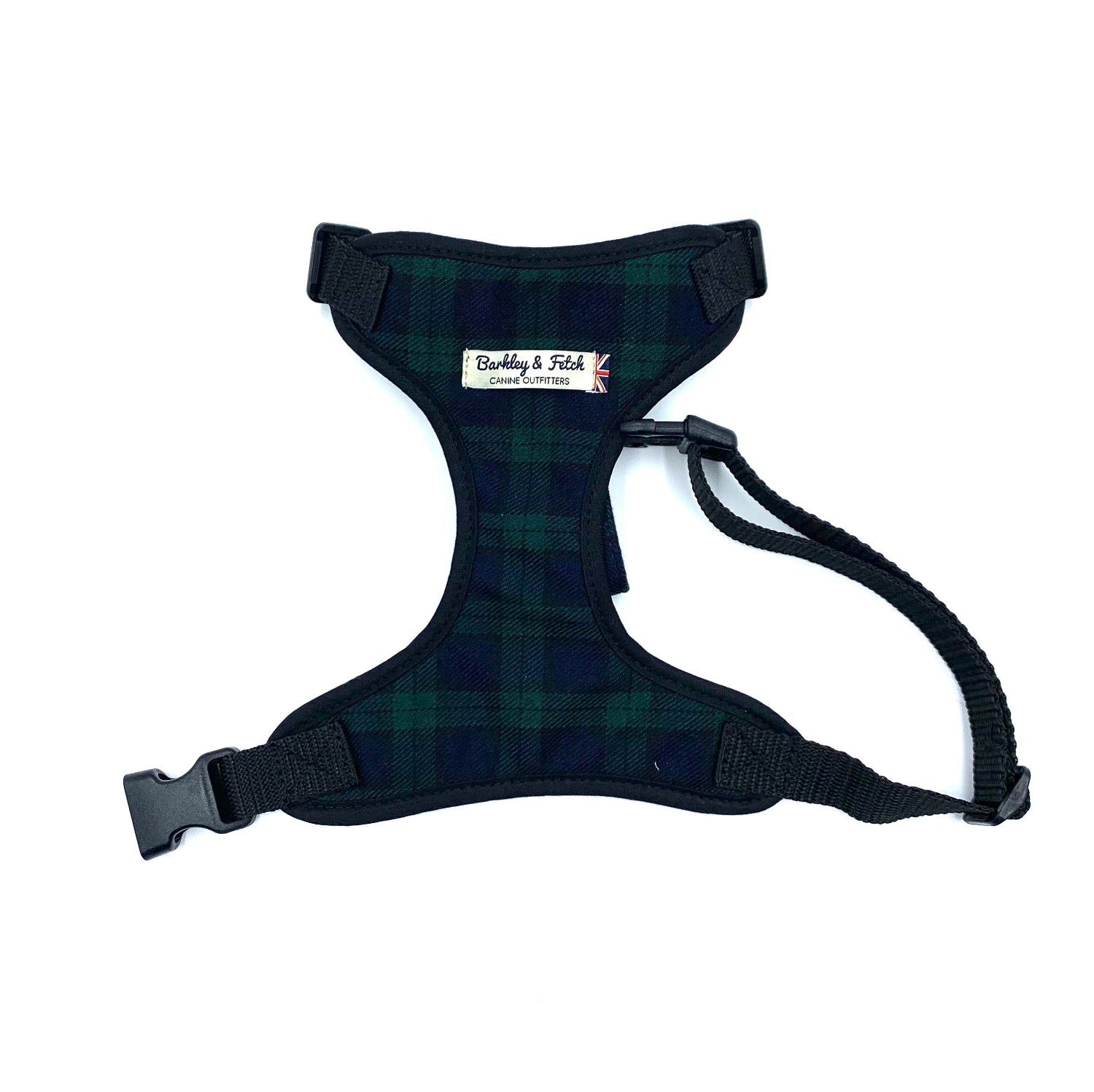 A black watch tartan fabric dog harness with adjustable straps and a side release buckle.