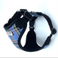 Dog harness with blue plaid pattern and black straps on a white background