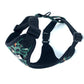 Dog harness with green camouflage pattern on a white background