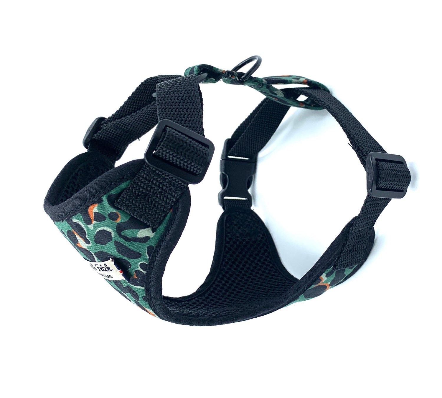 Dog harness with green camouflage pattern on a white background