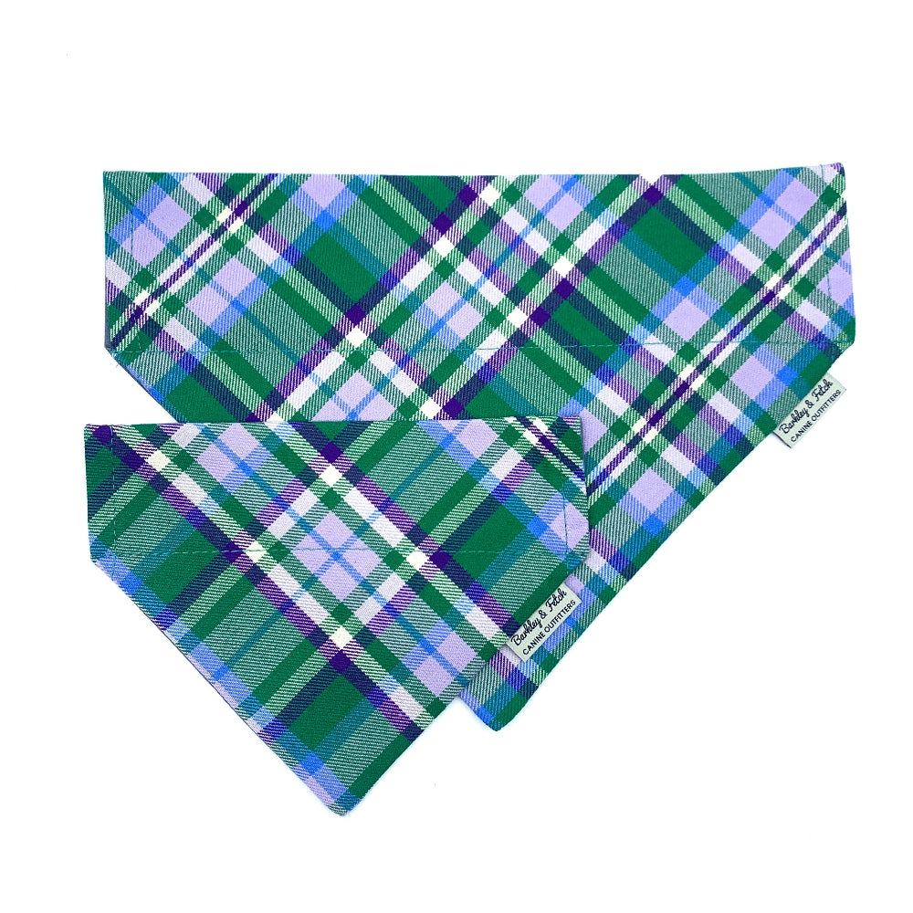 Green and blue plaid bandana with a brand label on a white background