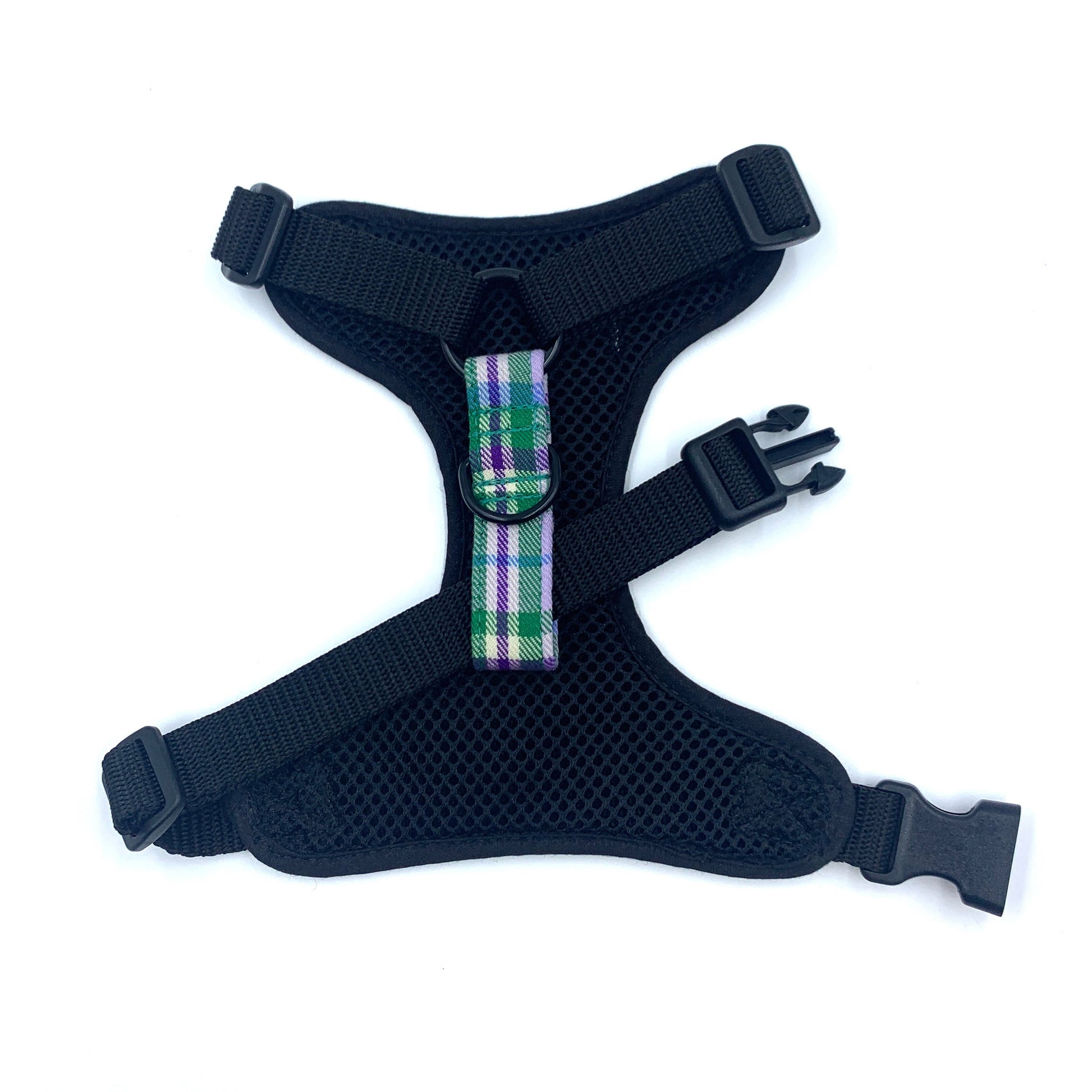 Black dog harness with plaid strap on a white background