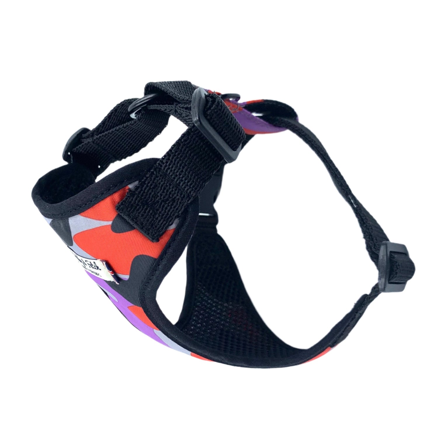 Black dog harness with colorful pattern on a white background