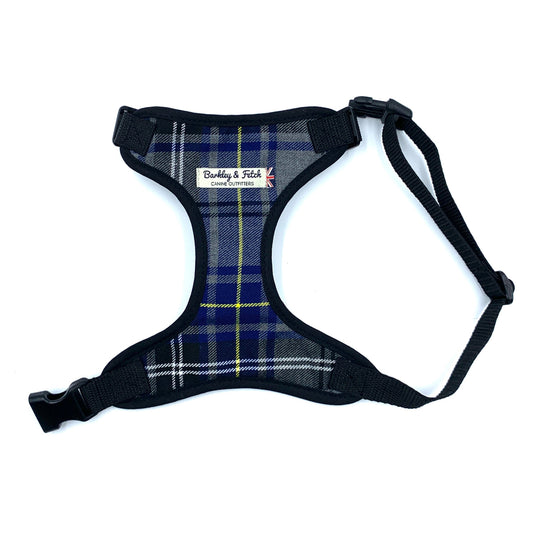 Plaid dog harness with visible brand label on a white background
