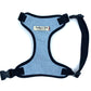 A pale blue wool herringbone fabric dog harness with adjustable straps, padded mesh, and a heavy duty d-ring. The harness is designed to slip over the dog's head and has a side release buckle.