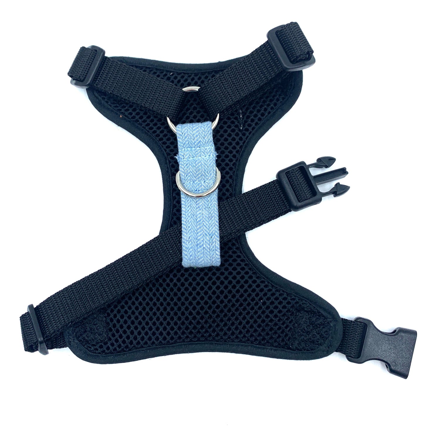 Black dog harness with a light blue strap on a white background