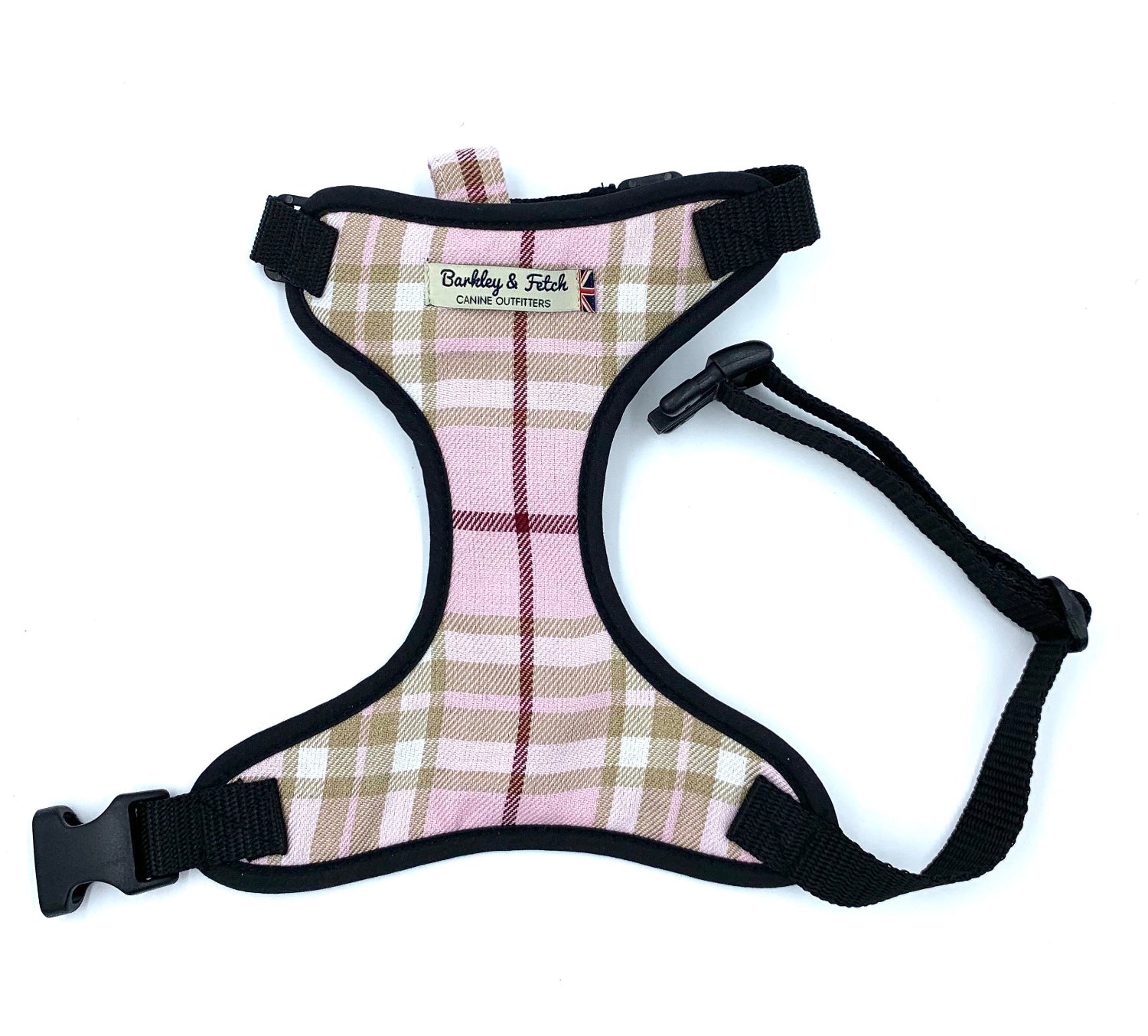 A pale pink tartan dog harness with adjustable straps and a side release buckle.