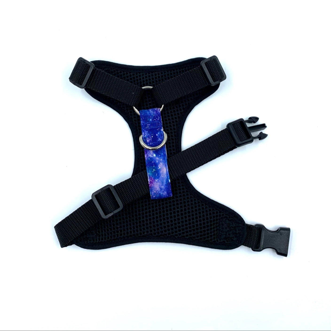 Black dog harness with a purple and blue patterned strap on a white background