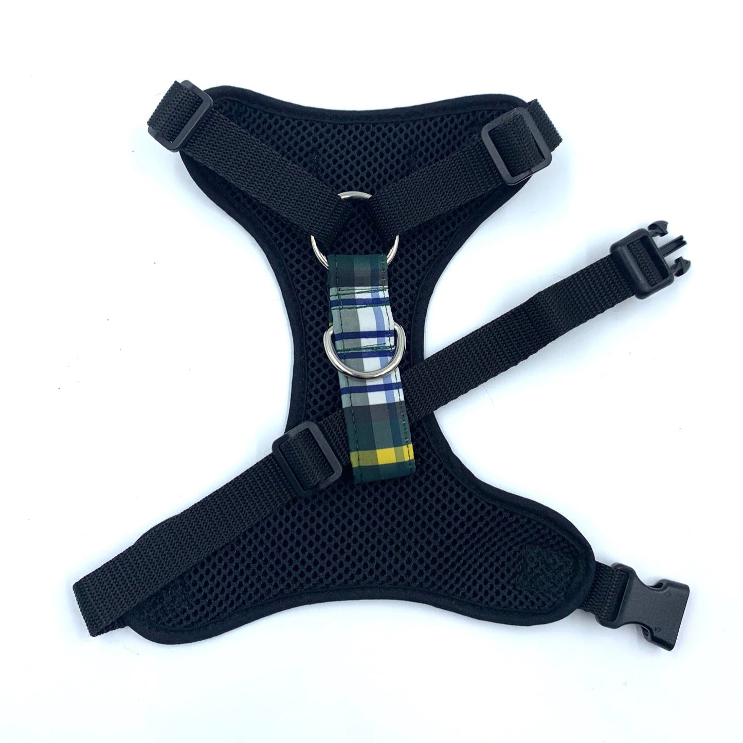 Black dog harness with plaid strap on a white background