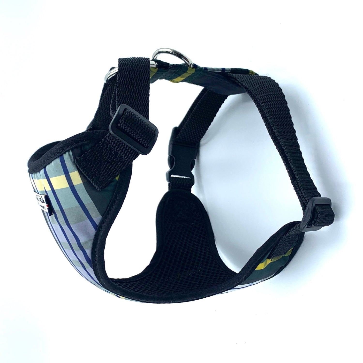 Black dog harness with plaid pattern on a white background