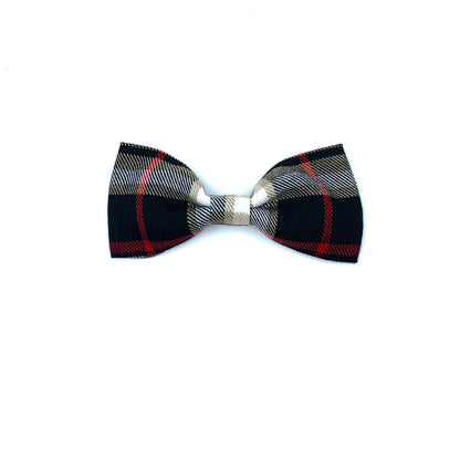 A black, beige, and red tartan check dog bowtie on a white background.