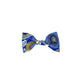 A dog bow tie with a blue background featuring a multicolored floral pattern.